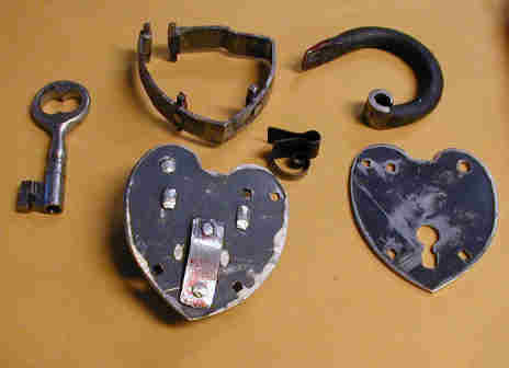 Padlock Dismantled with back turned over to show riveting 