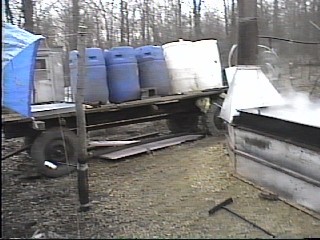 Barrels of Maple Sap and the Evaporator