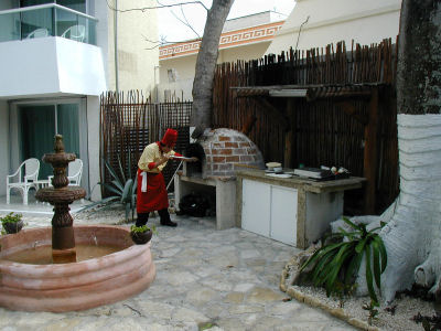 Pushing Coals to the Rear of the Stone Oven