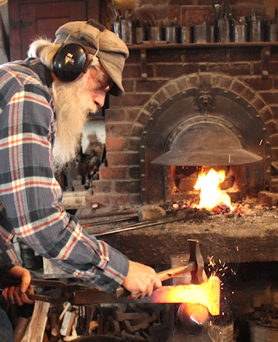 Tom at the forge